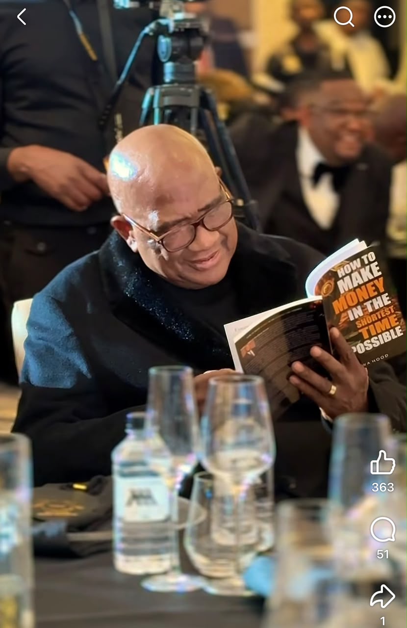 Guest reading the book at the launch dinner